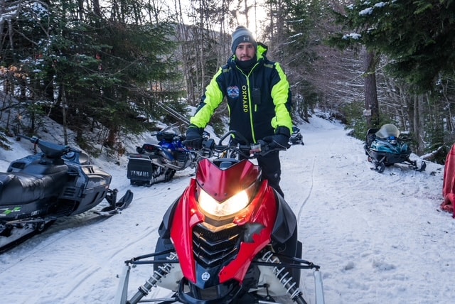 Snowmobile on mountain peak